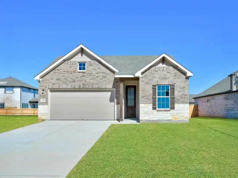 Representative exterior photo of a completed home built from the Cartwright by Ashton Woods in Saddlebrook Ranch, Schertz, TX (Image 13). Representative exterior photo of a completed home built from the Cartwright by Ashton Woods in Saddlebrook Ranch, Schertz, TX (Image 13).