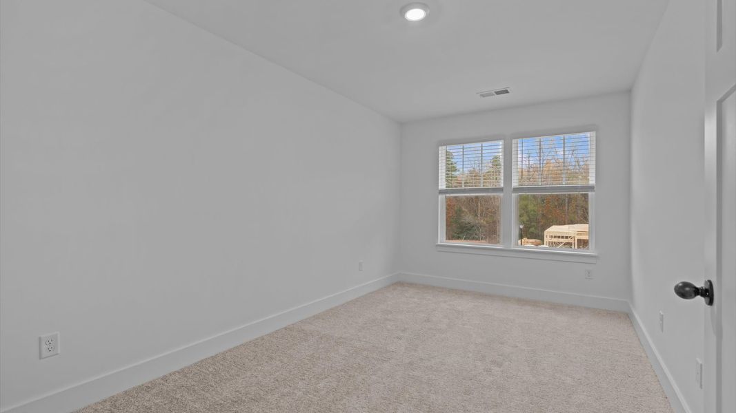 First-rate secondary bedroom with a spacious walk-in closet and elegant carpeted flooring First-rate secondary bedroom with a spacious walk-in closet and elegant carpeted flooring
