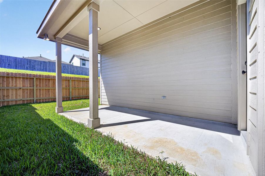 Exterior details and patio area of a home in Mostyn Springs, Magnolia (Image 23).
