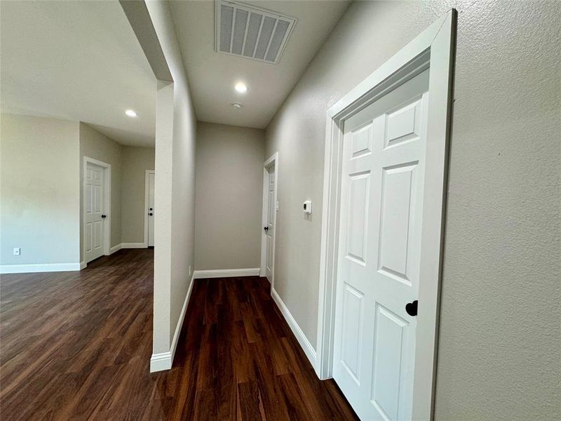 Hallway with wood-type flooring