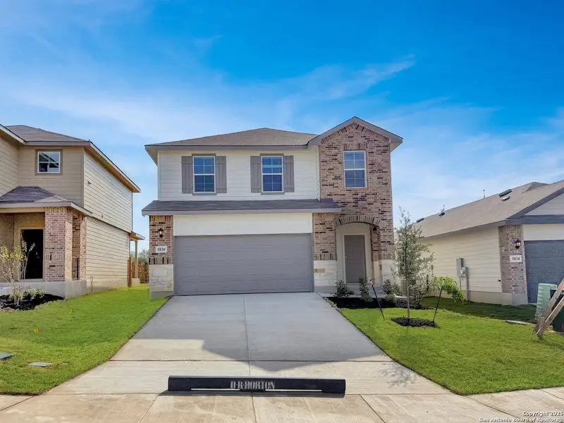 Front exterior of a new home in Stonehill, San Antonio, TX, highlighting curb appeal (Image 2). Front exterior of a new home in Stonehill, San Antonio, TX, highlighting curb appeal (Image 2).