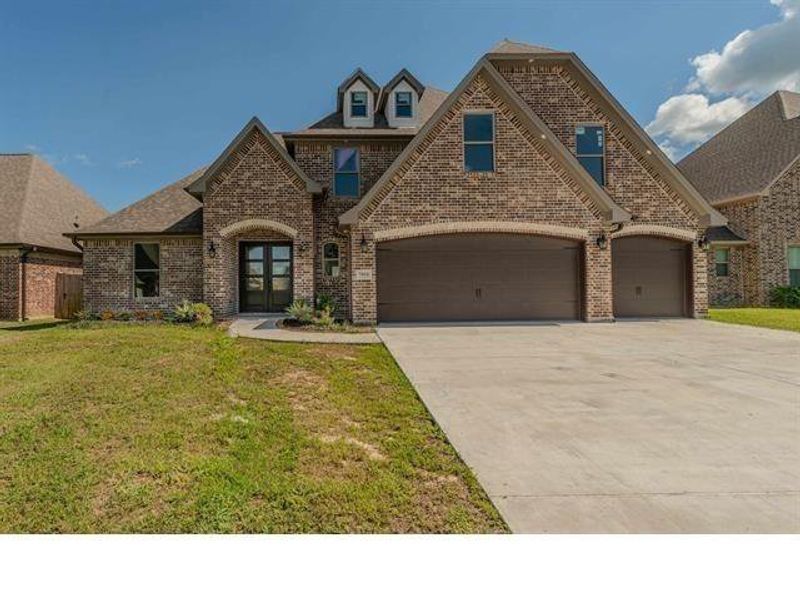 Front exterior of a new home in , Beaumont, TX, highlighting curb appeal (Image 1).