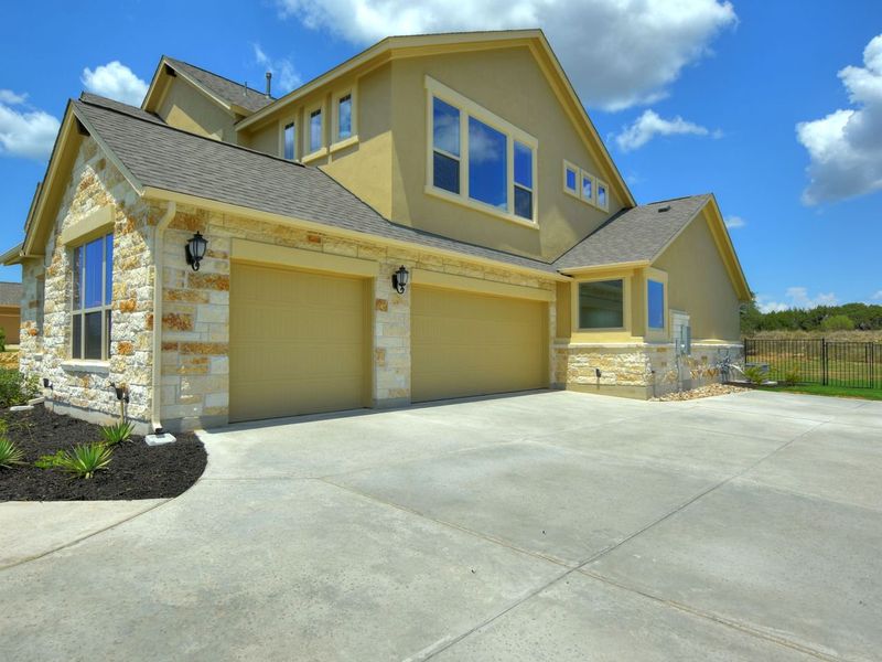 Representative exterior photo of a completed home built from the Madera II by Giddens Homes in Scofield Farms Estates, Georgetown, TX (Image 42).