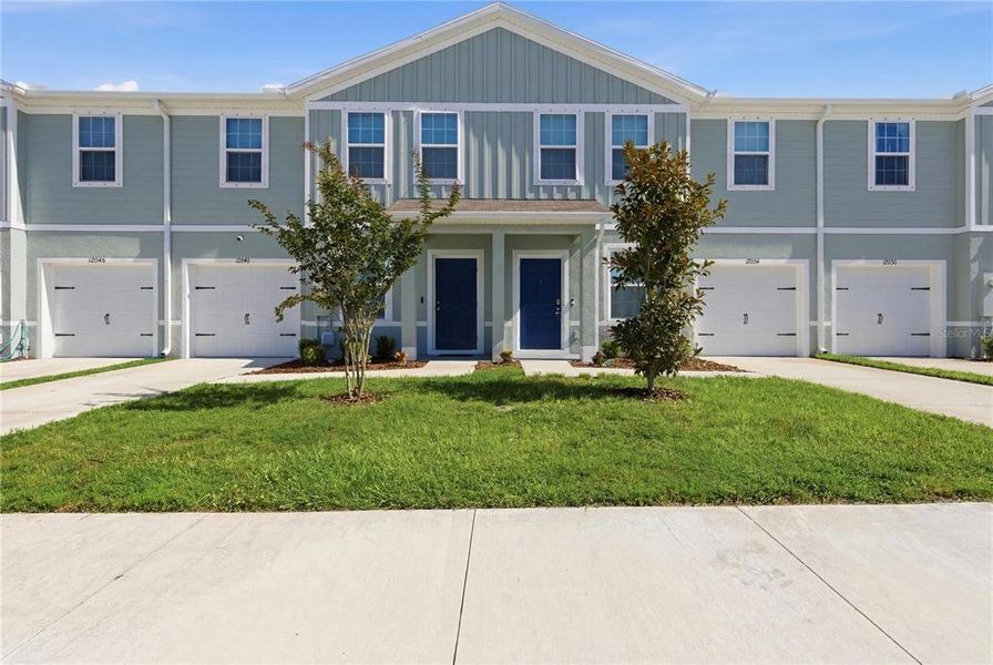 Front exterior of a new home in , New Port Richey, FL, highlighting curb appeal (Image 25).