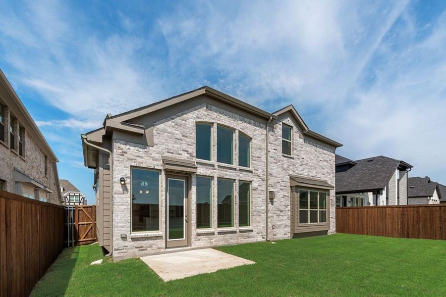 Front exterior of a new home in Dominion of Pleasant Valley, Wylie, TX, highlighting curb appeal (Image 2).