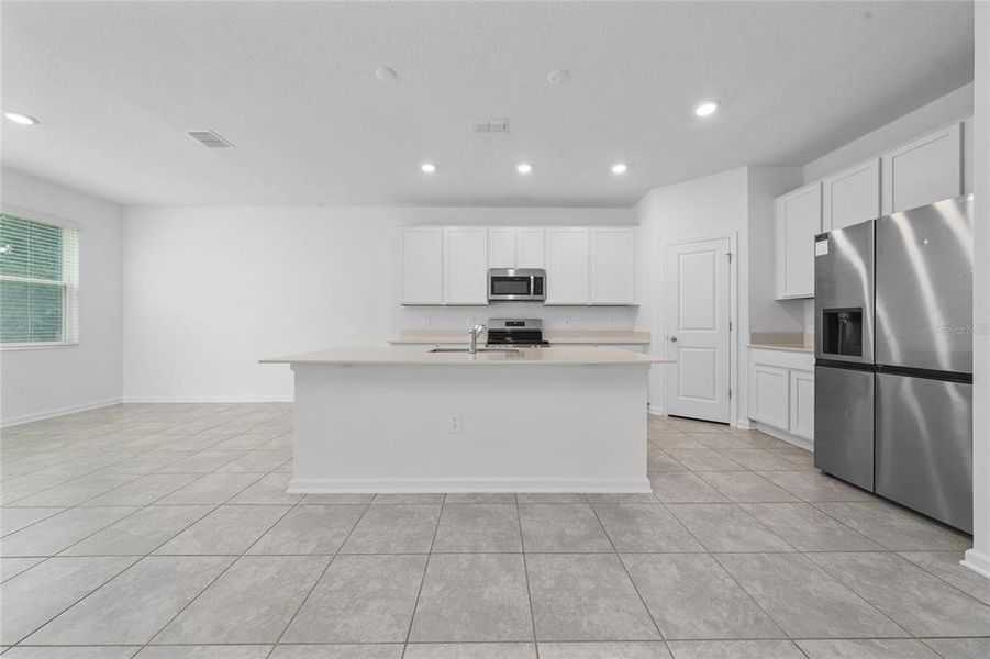 Furnished interior view inside a new home in Storey Creek, Kissimmee (Image 11).