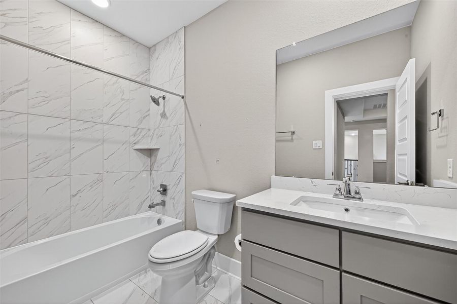 Secondary bathroom upstairs with tub/shower combo.