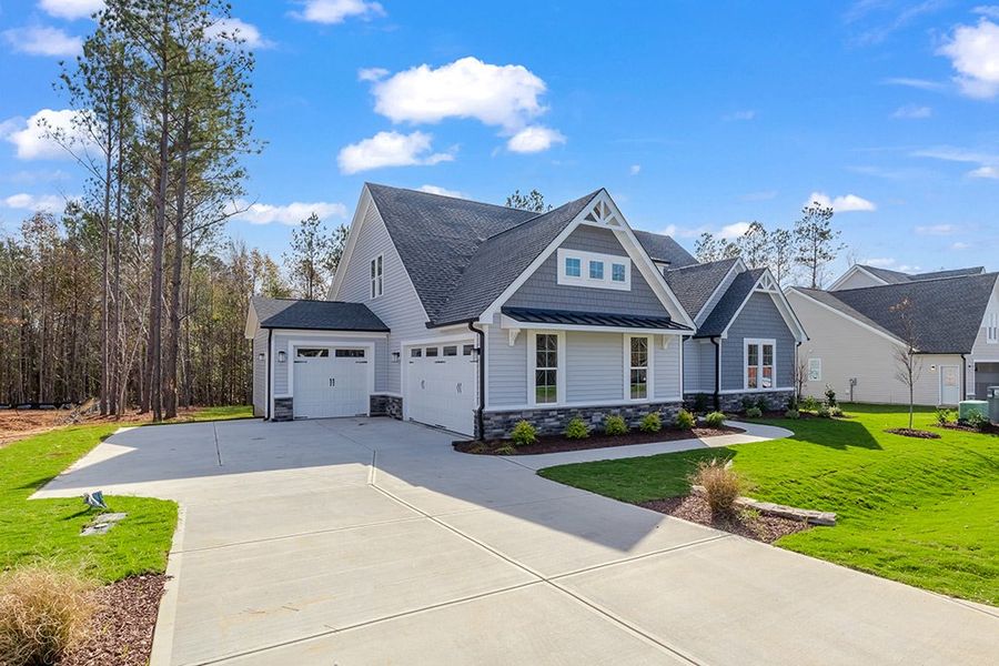 Representative exterior photo of a completed home built from the The Bradley by RobuckHomes in Baylee Ridge, Selma, NC (Image 36). Representative exterior photo of a completed home built from the The Bradley by RobuckHomes in Baylee Ridge, Selma, NC (Image 36).