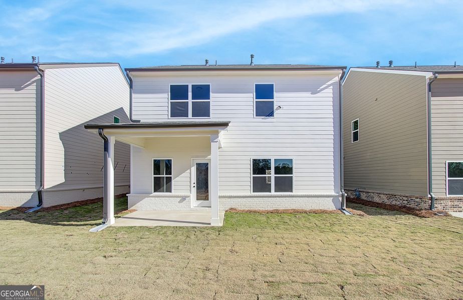 Front exterior of a new home in Crofton Place Enclave, Snellville, GA, highlighting curb appeal (Image 2).