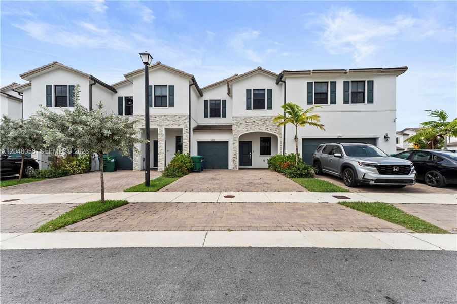 Front exterior of a new home in , Miami, FL, highlighting curb appeal (Image 1). Front exterior of a new home in , Miami, FL, highlighting curb appeal (Image 1).