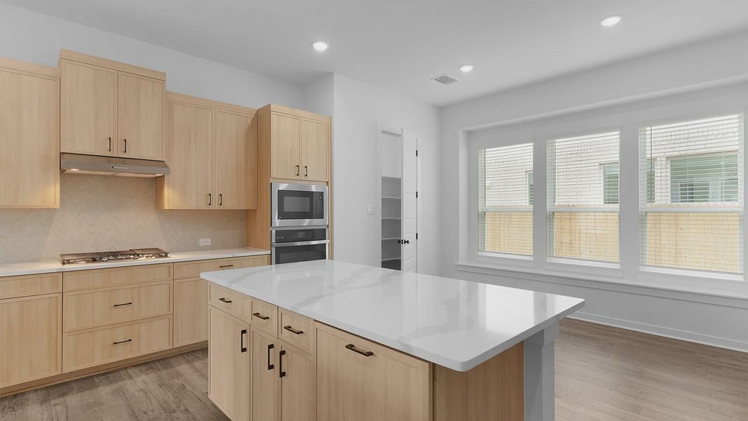 Representative furnished interior of a home built from the Acadia by Chesmar Homes in Crescent Bluff, Georgetown (Image 7).