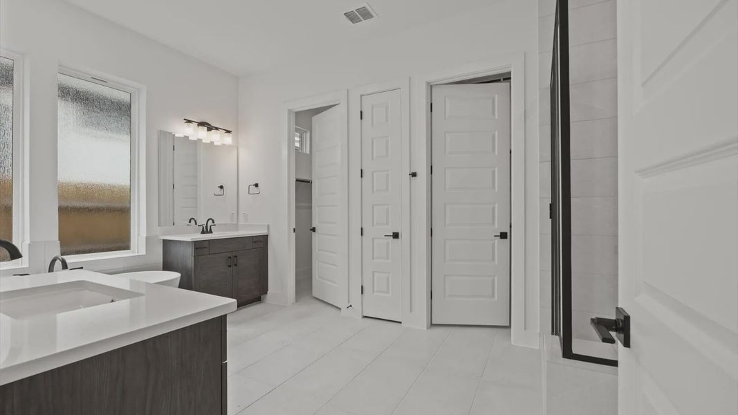 Furnished interior view inside a new home in 6 Creeks, Kyle (Image 8).