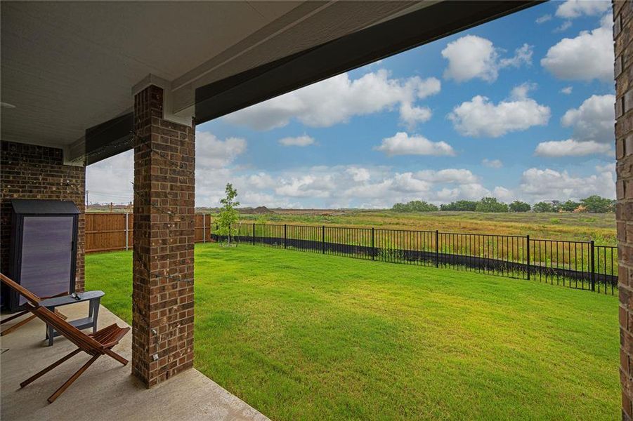 Exterior details and patio area of a home in Mobberly Farms, Pilot Point (Image 3).