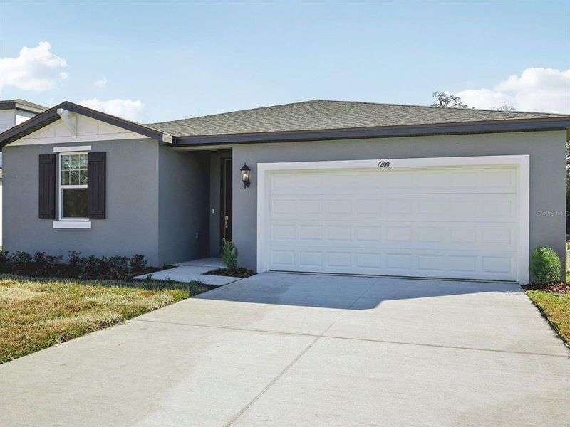 Front exterior of a new home in Leyland Preserve - Classic Series, Brooksville, FL, highlighting curb appeal (Image 20).