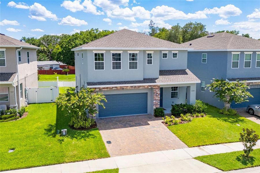 Front exterior of a new home in , Casselberry, FL, highlighting curb appeal (Image 24). Front exterior of a new home in , Casselberry, FL, highlighting curb appeal (Image 24).