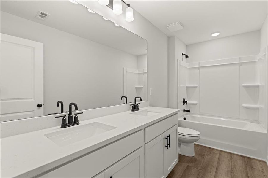 Furnished interior view inside a new home in The Bluffs, Canton (Image 11).