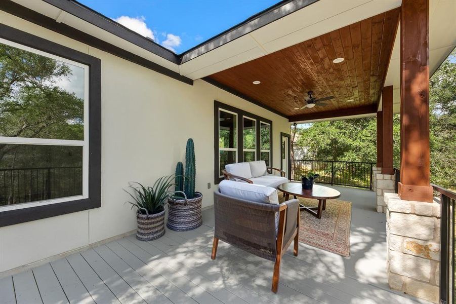 View of patio featuring an outdoor living space and a ceiling fan