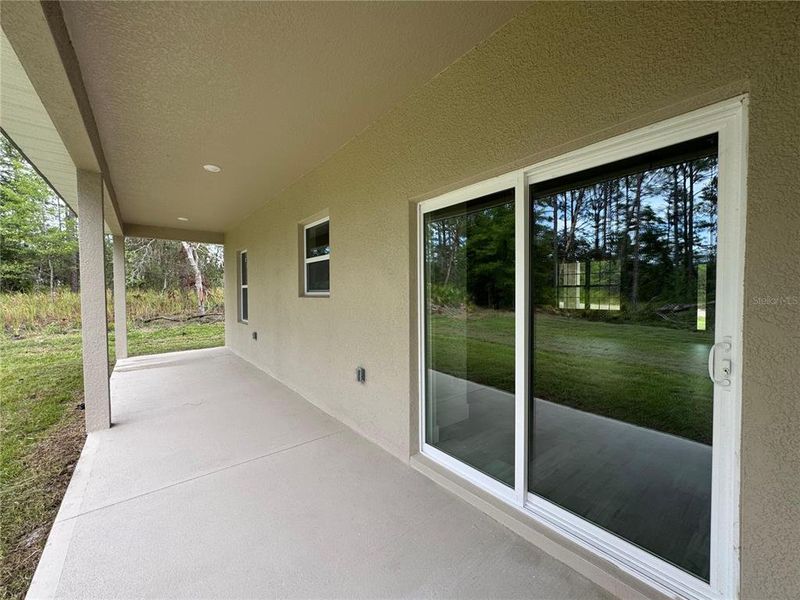 Exterior details and patio area of a home in , Citrus Springs (Image 24).