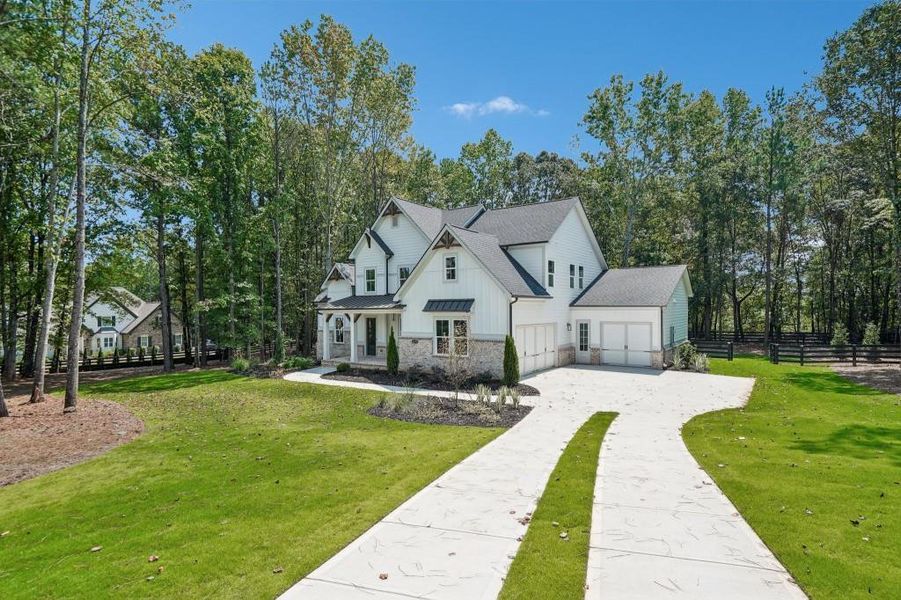 Front exterior of a new home in , Cumming, GA, highlighting curb appeal (Image 32).