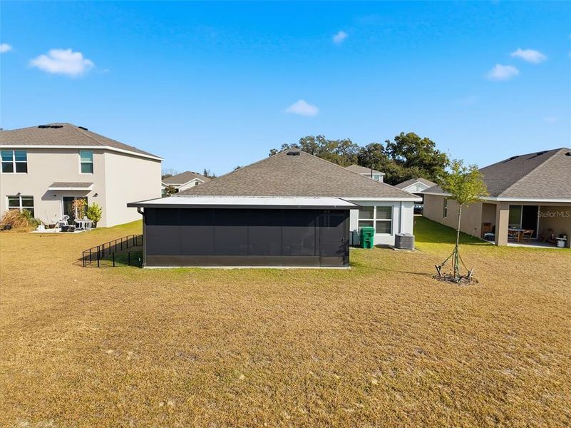 Exterior details and patio area of a home in Twisted Oaks, Wildwood (Image 28).