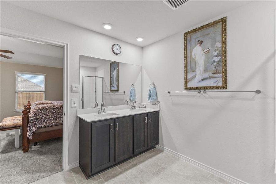 Master bath includes his and her sinks, large shower and ample cabinetr Master bath includes his and her sinks, large shower and ample cabinetr