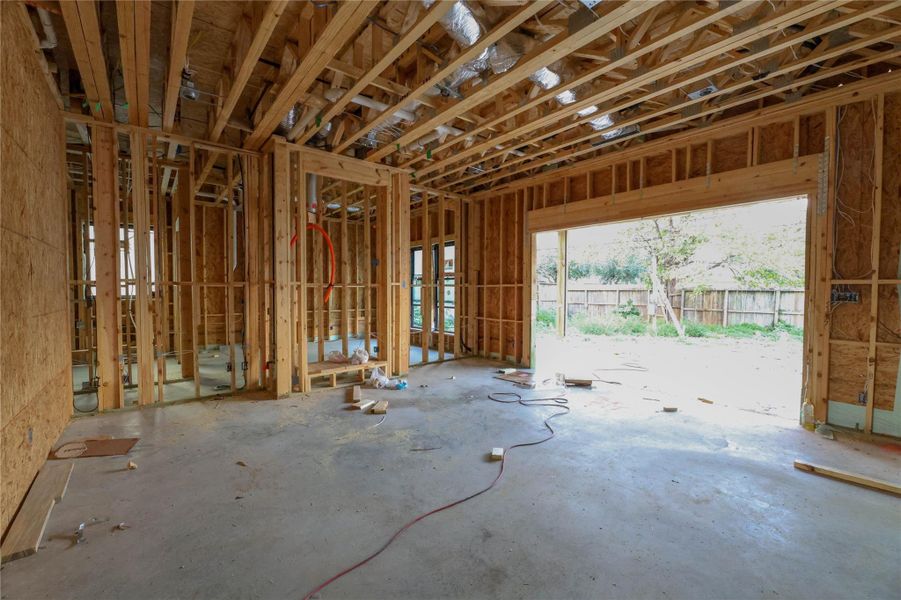*Construction Progress photo taken 11/20/25* Family Room view #2 - Custom living room built-ins w/ fireplace. The Junior Primary Suite located behind Family Room.
