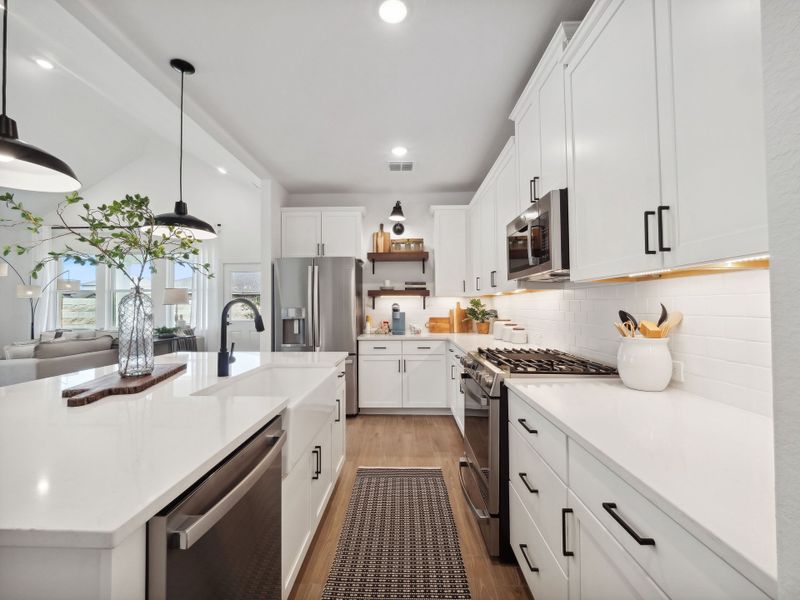 Kitchen with pendant lighting and floating shelves Kitchen with pendant lighting and floating shelves