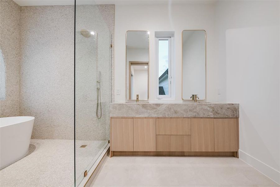 Full bath with walk in shower, a soaking tub, and double vanity