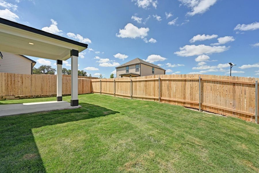 Front exterior of a new home in Creekside at Estancia, Austin, TX, highlighting curb appeal (Image 17).