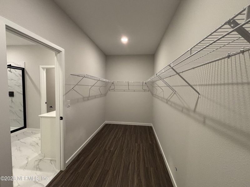 Spacious, unfurnished interior of a new home in The Cypress Series at Reserve East, Flagler Beach (Image 32).