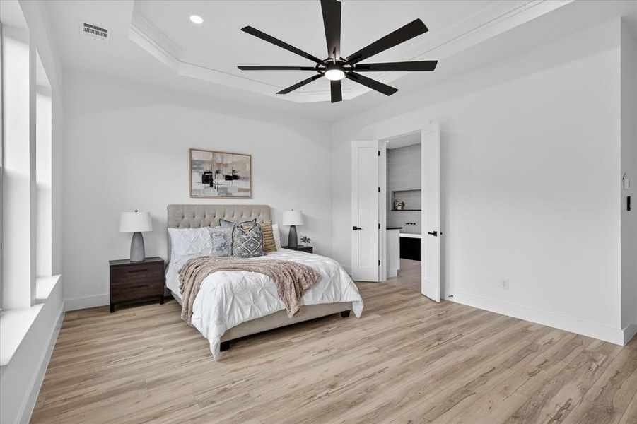 Bedroom featuring light wood-type flooring, a ceiling fan, and recessed lighting