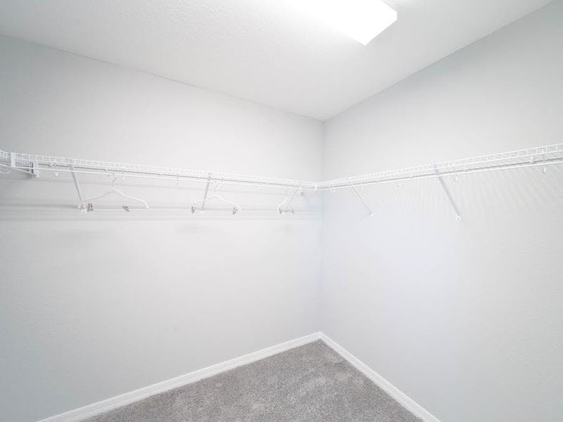 Your owner`s oasis also includes a spacious walk-in wardrobe - Magnolia townhome by Highland Homes Your owner`s oasis also includes a spacious walk-in wardrobe - Magnolia townhome by Highland Homes