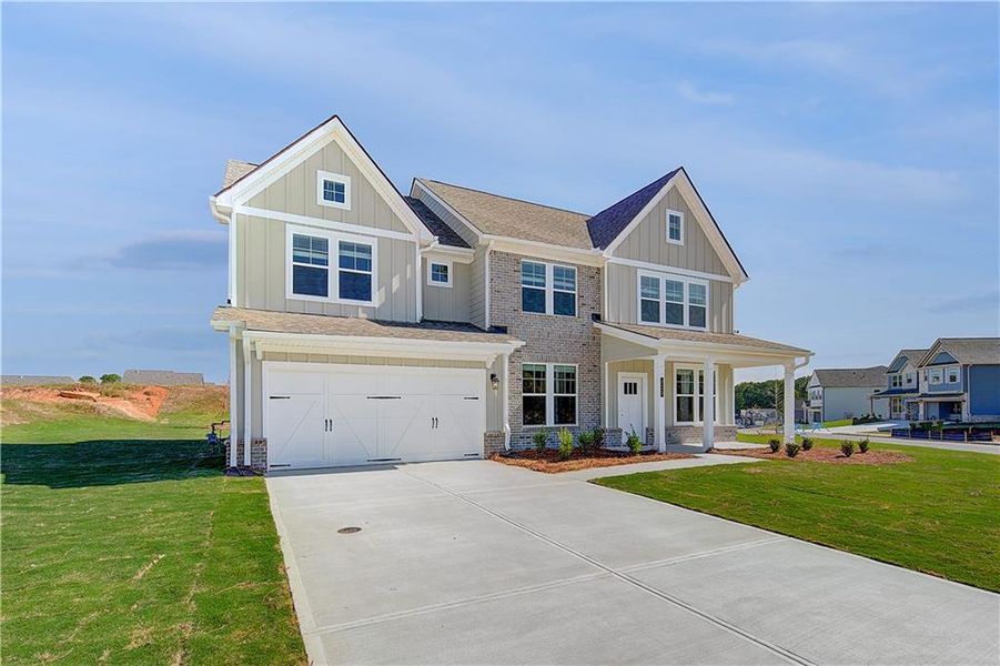 Front exterior of a new home in Grandview at Millers Mill, Stockbridge, GA, highlighting curb appeal (Image 18).