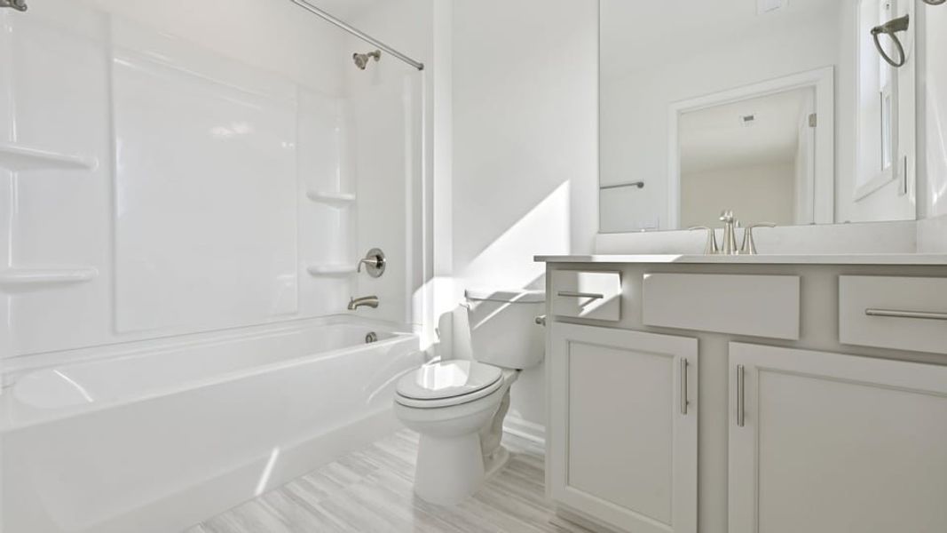 Representative furnished interior of a home built from the Wylie by D.R. Horton in Eagle Creek, Fuquay Varina (Image 9).