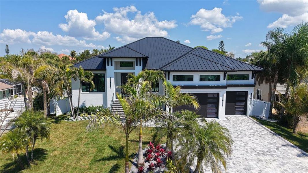 Front exterior of a new home in , Sarasota, FL, highlighting curb appeal (Image 21).