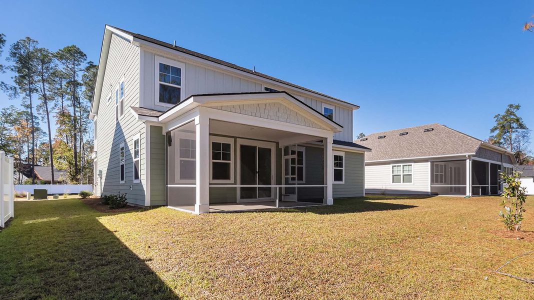 Exterior details and patio area of a home in Heron Pointe, Myrtle Beach (Image 3).