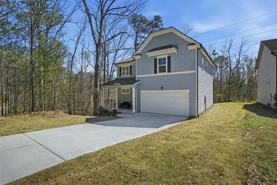Front exterior of a new home in Tell River, Atlanta, GA, highlighting curb appeal (Image 2). Front exterior of a new home in Tell River, Atlanta, GA, highlighting curb appeal (Image 2).