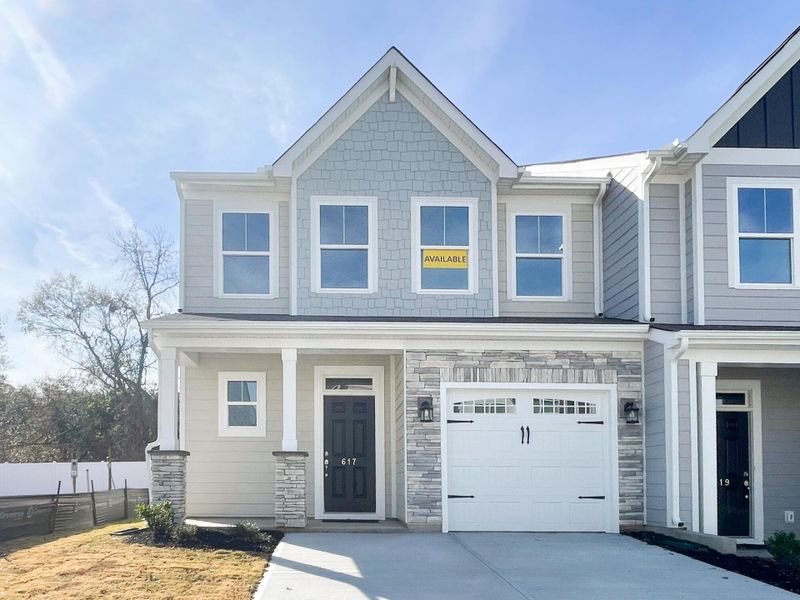 Front exterior of a new home in Riverbrooke Townhomes, Simpsonville, SC, highlighting curb appeal (Image 1).