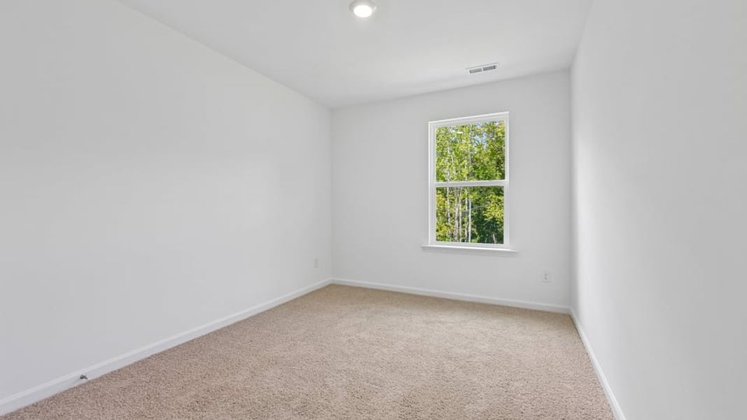 Spacious, unfurnished interior of a new home in The Townes at Belle Grove, Wendell (Image 16).