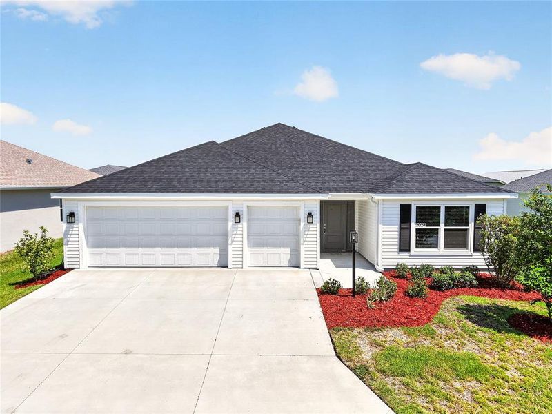 Front exterior of a new home in , The Villages, FL, highlighting curb appeal (Image 29).