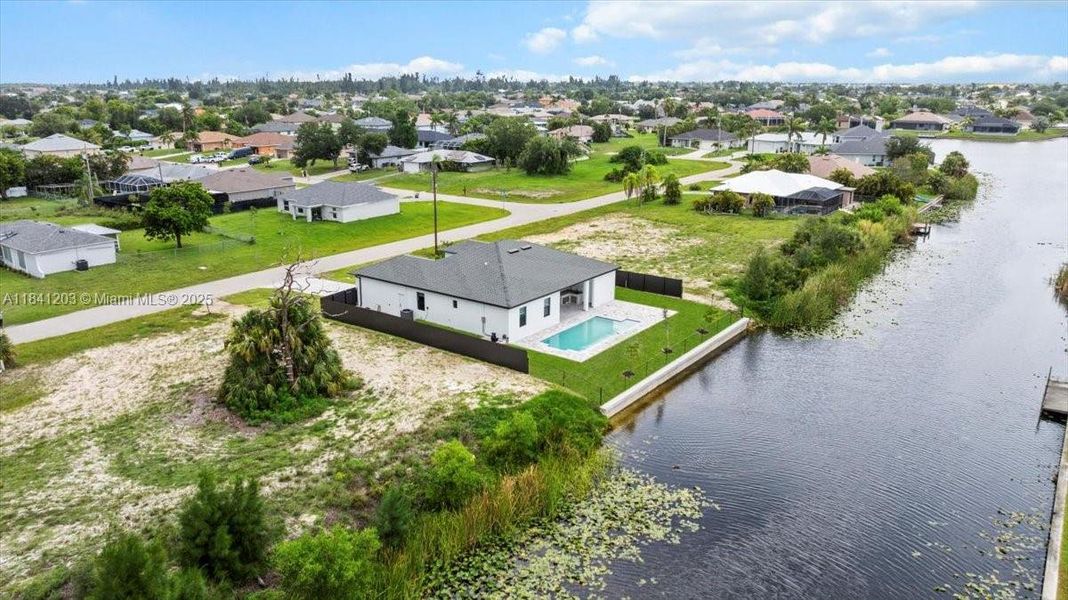 Front exterior of a new home in , Cape Coral, FL, highlighting curb appeal (Image 28). Front exterior of a new home in , Cape Coral, FL, highlighting curb appeal (Image 28).