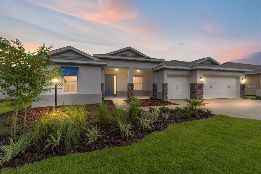 Front exterior of a new home in On Top of the World Communities, Ocala, FL, highlighting curb appeal (Image 22). Front exterior of a new home in On Top of the World Communities, Ocala, FL, highlighting curb appeal (Image 22).
