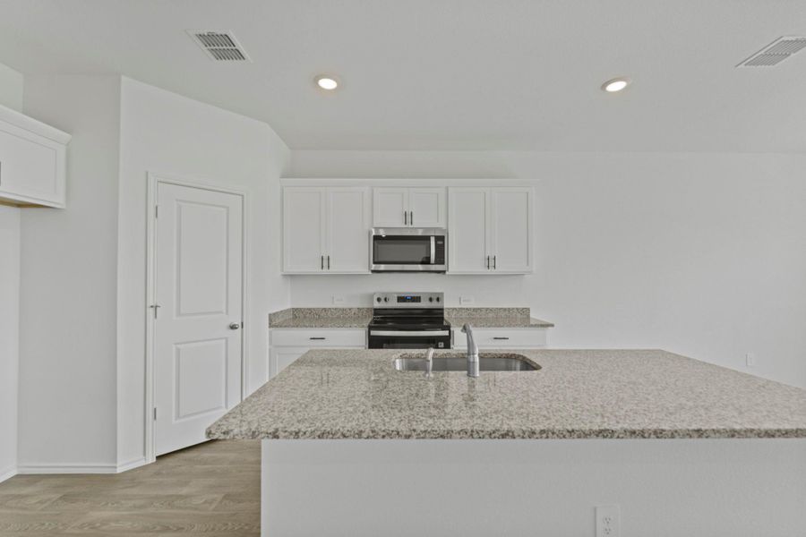 Furnished interior view inside a new home in Palomino, Manor (Image 9).