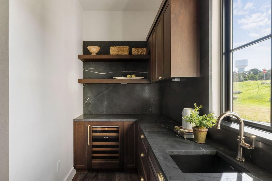 Dedicated Butler's Pantry with Brizo Rook Collection Faucet, Wine Fridge, and Saratoga Quartzite Countertops