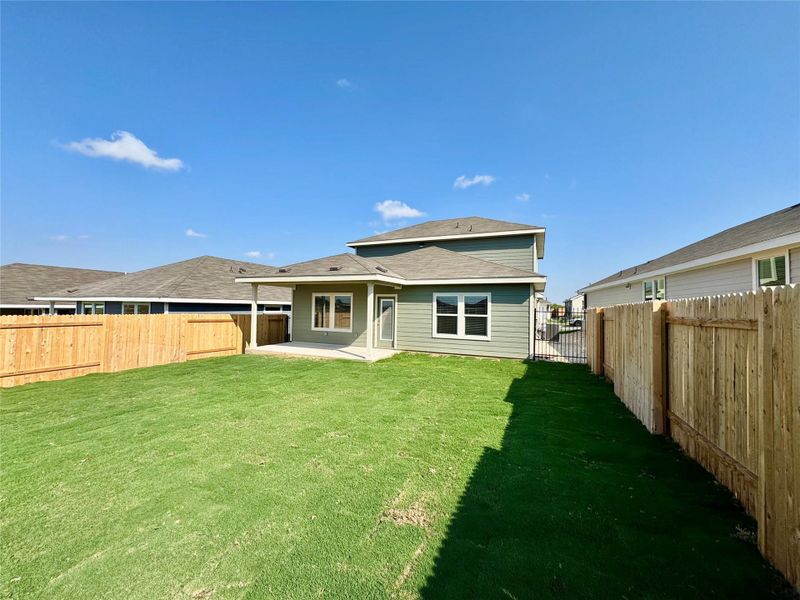 Rear view of property featuring a patio area and a fenced backyard Rear view of property featuring a patio area and a fenced backyard