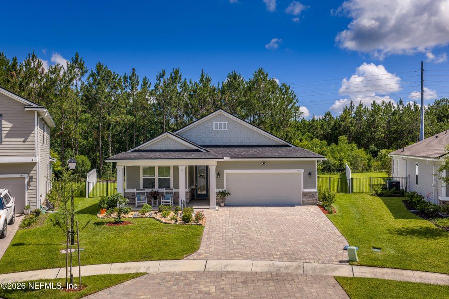 Front exterior of a new home in Elm Creek at Silverleaf, St. Augustine, FL, highlighting curb appeal (Image 1). Front exterior of a new home in Elm Creek at Silverleaf, St. Augustine, FL, highlighting curb appeal (Image 1).