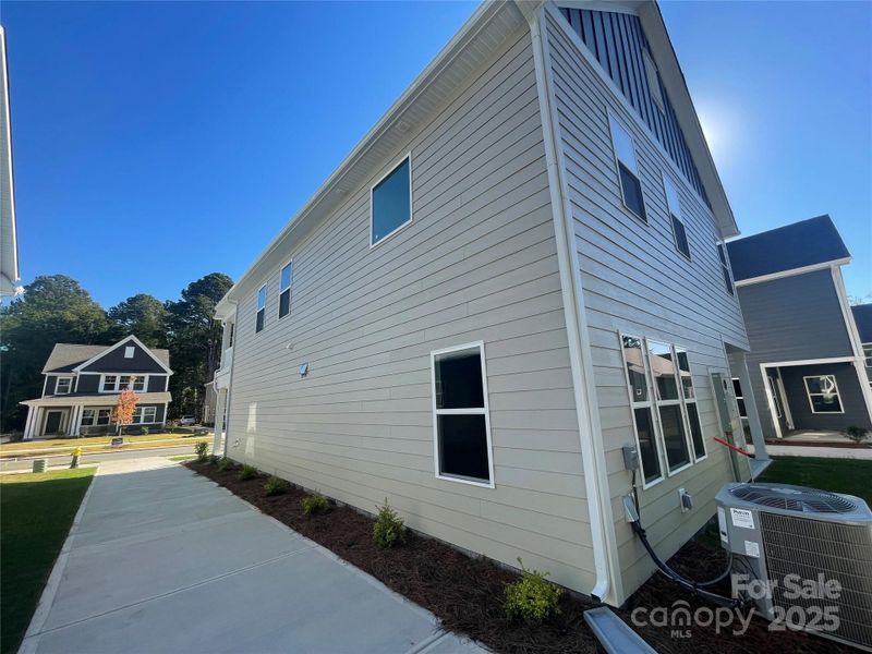 Exterior details and patio area of a home in Arbor Village, Matthews (Image 12).