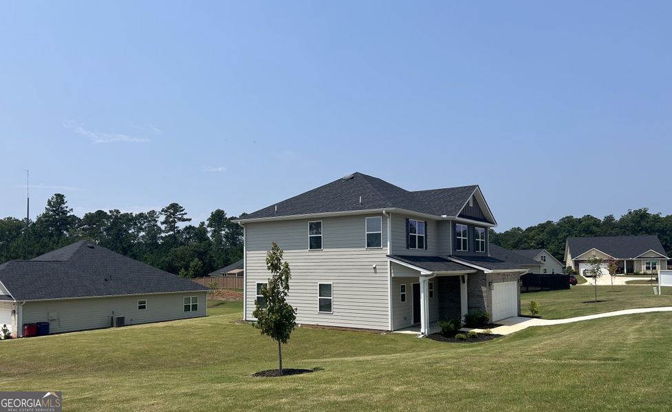 Front exterior of a new home in Barrington Place, Macon, GA, highlighting curb appeal (Image 2). Front exterior of a new home in Barrington Place, Macon, GA, highlighting curb appeal (Image 2).