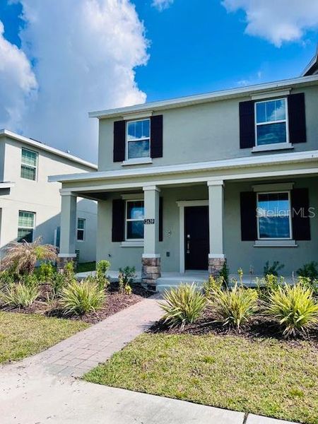 Front exterior of a new home in , Kissimmee, FL, highlighting curb appeal (Image 21). Front exterior of a new home in , Kissimmee, FL, highlighting curb appeal (Image 21).