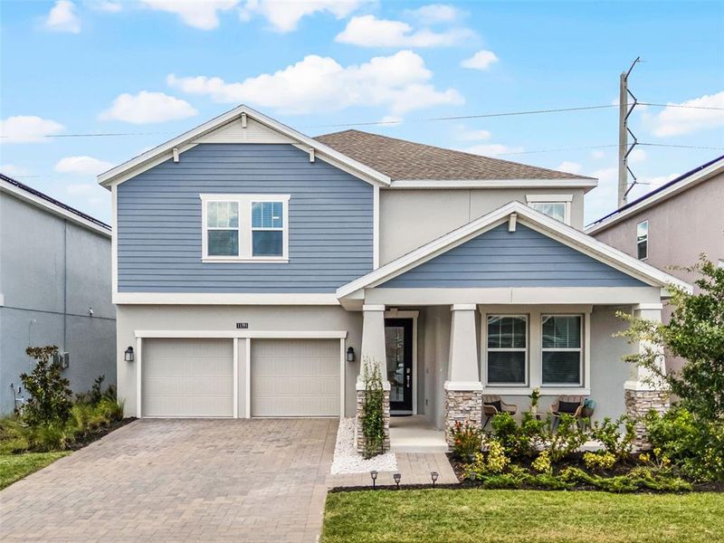 Front exterior of a new home in , Orlando, FL, highlighting curb appeal (Image 22).